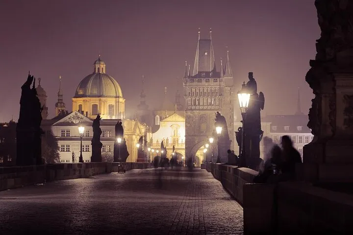 Lantern-lit castle district street at night on an alchemy ghost tour in Prague, Czechia